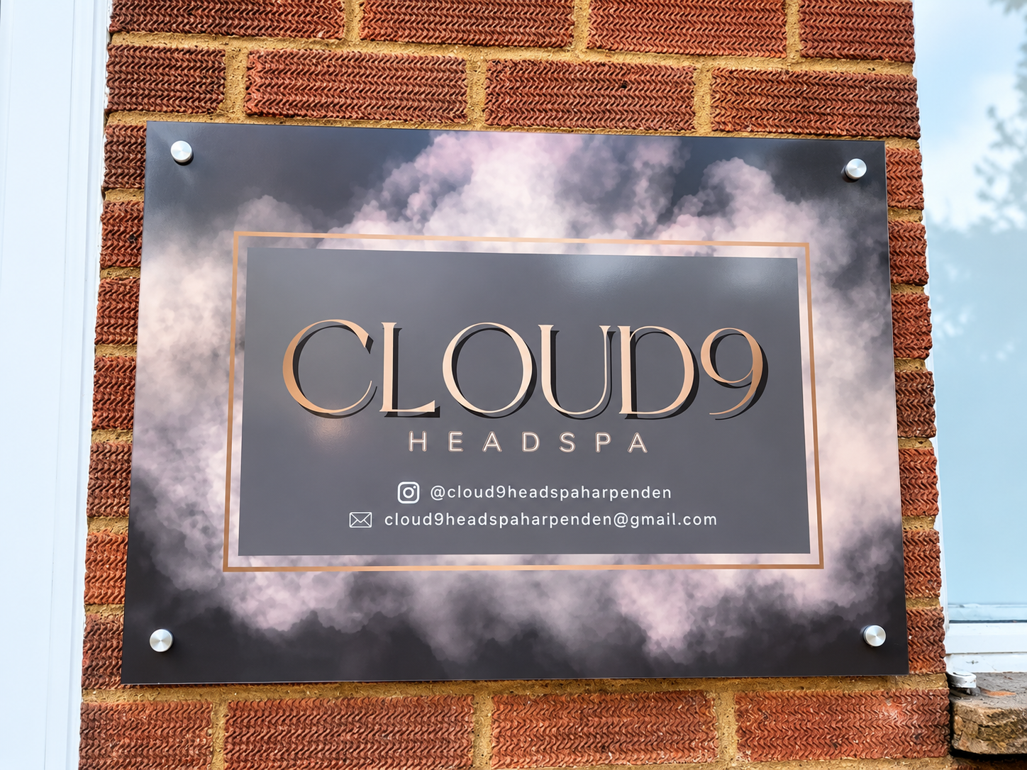 Cloud 9 Head Spa exterior plaque beside the entrance.